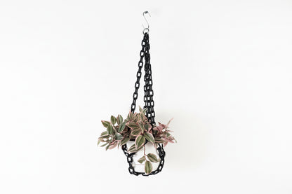 Black chain hanging planter from The Vault Creative featuring a modern design for indoor or outdoor plant display.