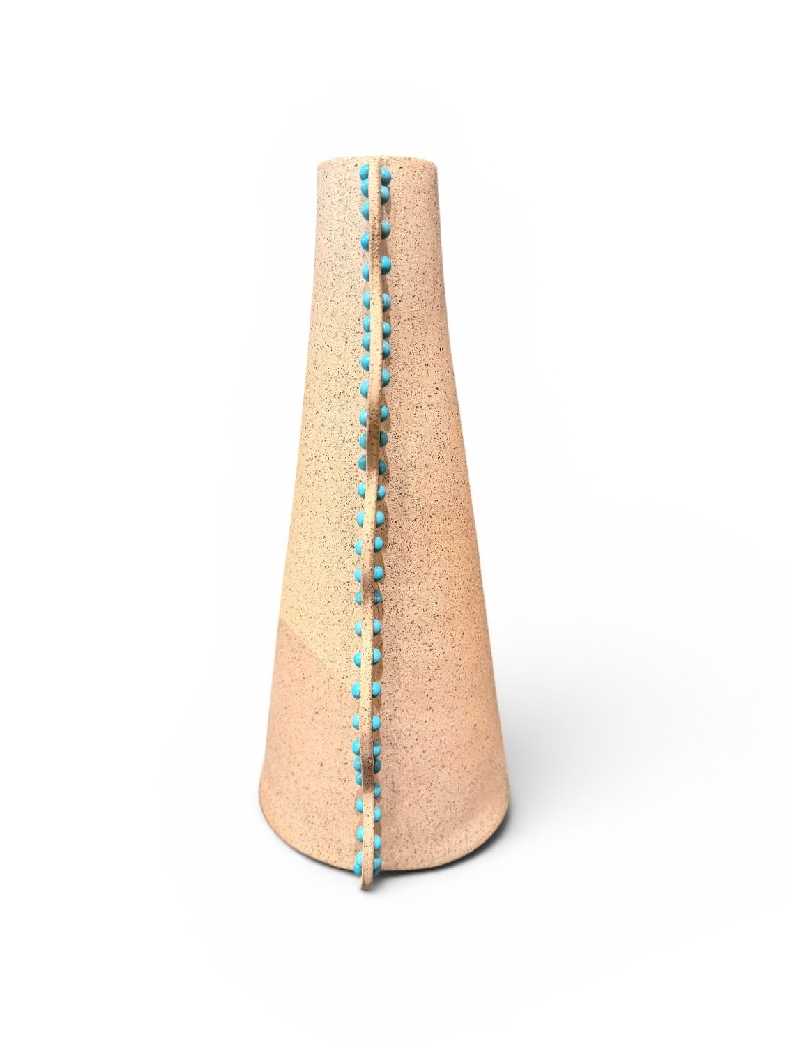 Ceramic Wavy Vase by P.Grunsfeld from The Vault Creative, featuring a textured, wavy design in neutral tones.