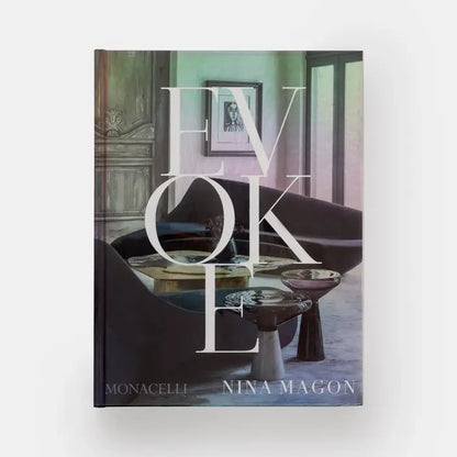 Open book titled "Evoke: Nina Magon" by Phaidon, showing colorful interior pages with design images and artwork.