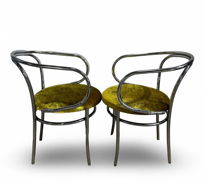 Set of four chrome Thonet chairs by Ozmun Home with sleek metal frames and curved wooden seats, modern and stylish for dining.