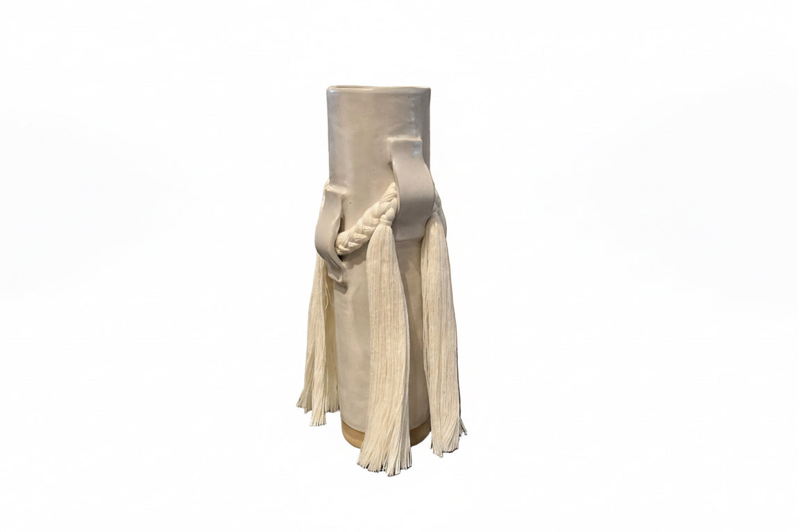White ceramic vase by Karen Tinney for The Vault Creative, featuring a sleek, modern design and smooth finish.