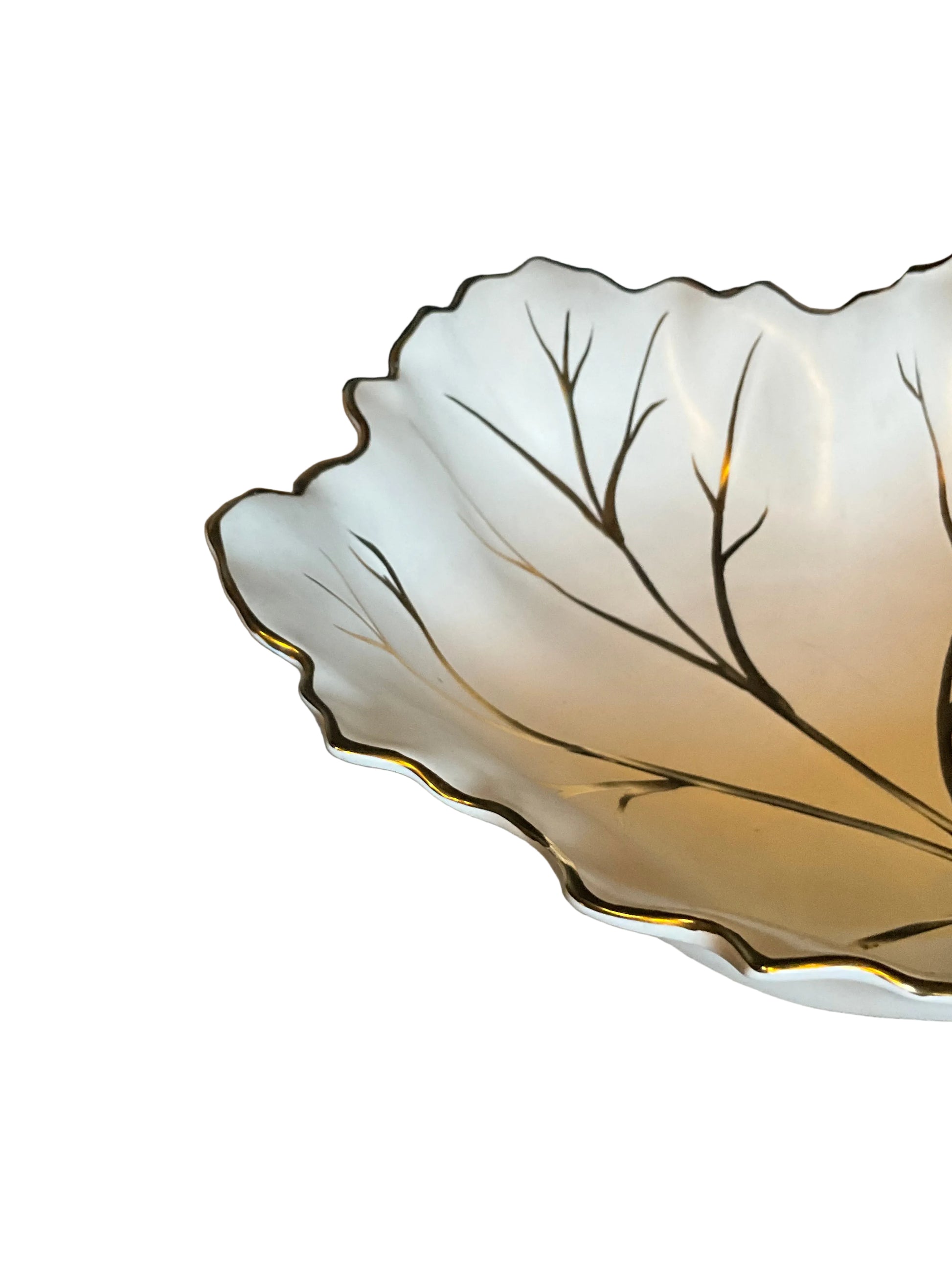 Vintage Limoges porcelain leaf dish with delicate gold accents, showcasing intricate leaf design and fine craftsmanship.