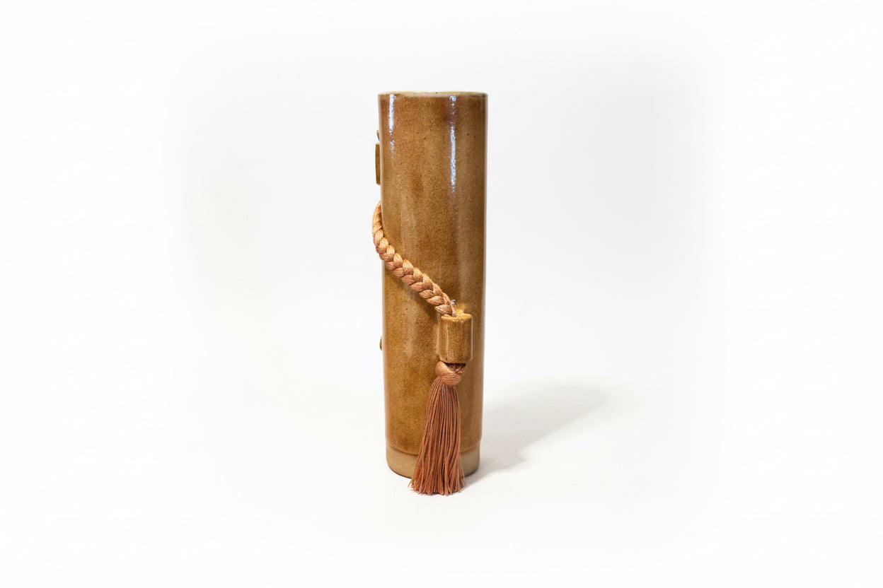 Amber glass vase by Karen Tinney for The Vault Creative, featuring a sleek, modern design with a smooth finish.