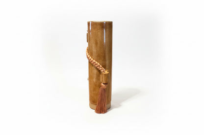 Amber glass vase by Karen Tinney for The Vault Creative, featuring a sleek, modern design with a smooth finish.