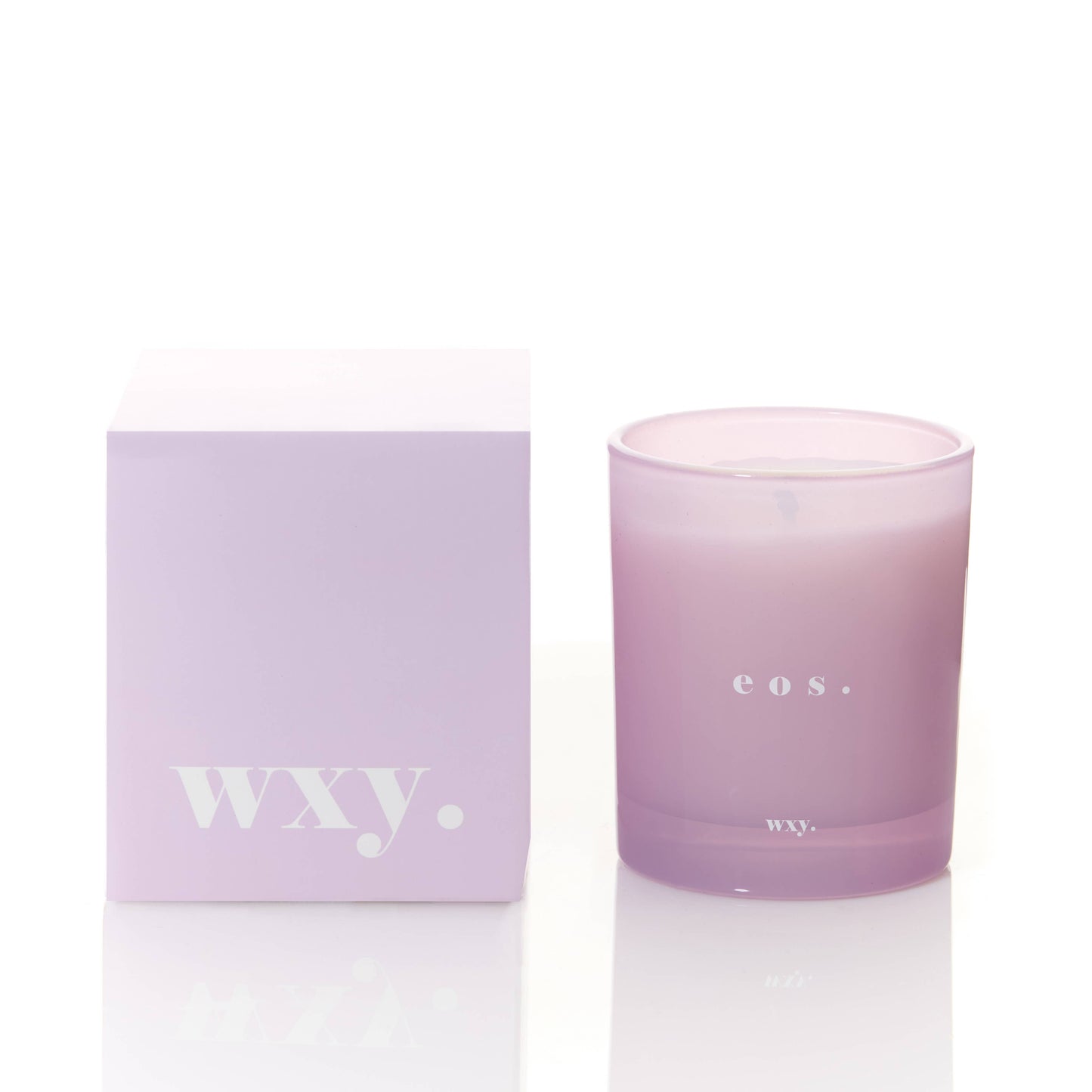 WXY eos 7oz candle featuring Orris Root and Amber scent in a glass jar with a lit wick and decorative packaging.