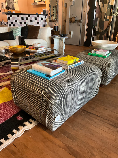 Vintage Ottoman Coffee Table by The Vault Creative with wooden top and upholstered base, showcasing a classic, stylish design.