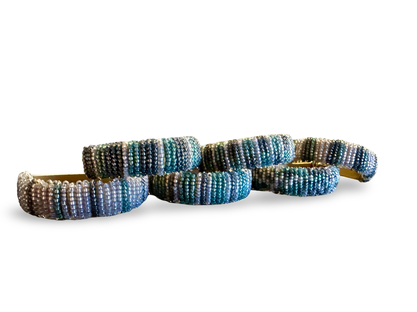 Set of six beaded napkin rings from The Vault Creative, featuring colorful beaded accents for elegant table settings.