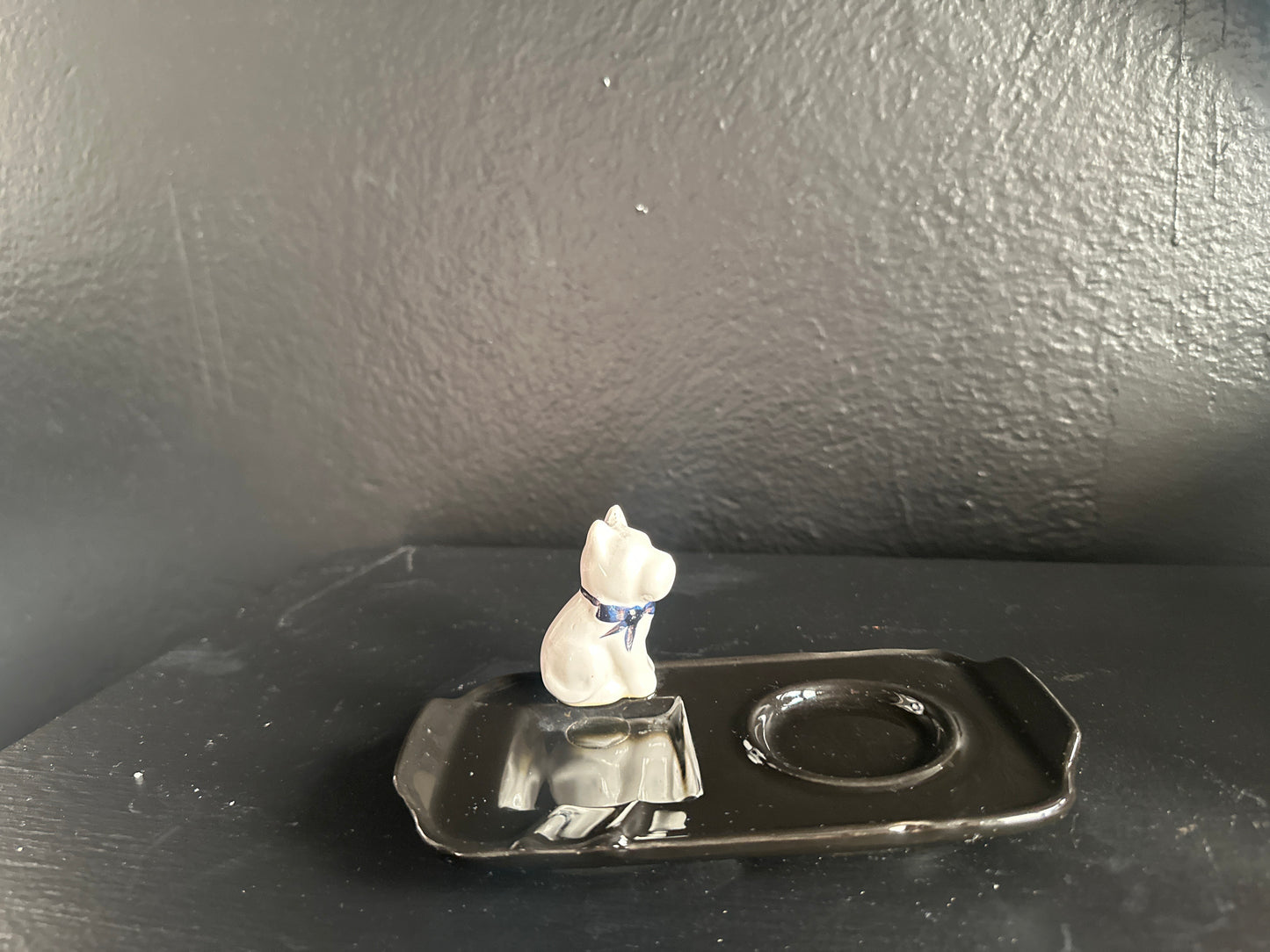 French dog ashtray by The Vault Creative featuring a detailed ceramic sculpture of a dog with a hollow center for ashes
