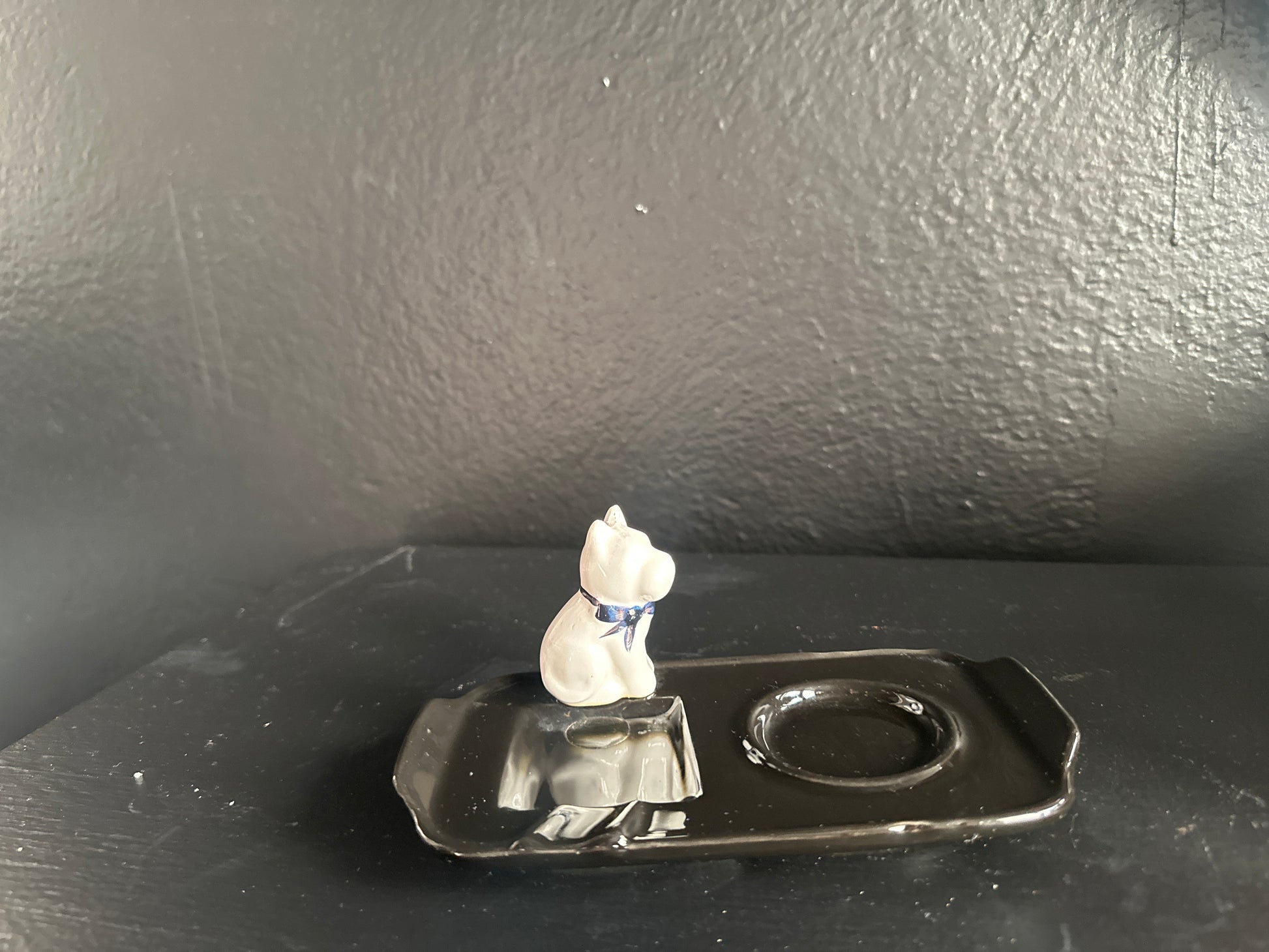 French dog ashtray by The Vault Creative featuring a detailed ceramic sculpture of a dog with a hollow center for ashes