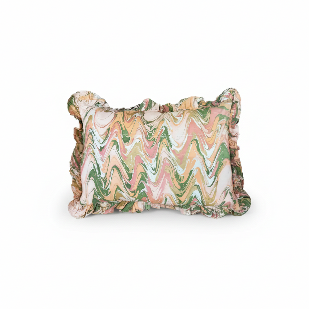 Peony Bloom ruffled hand-marbled pillow by The Vault Creative featuring soft pink and white floral patterns and textured ruffles.
