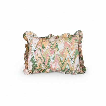 Peony Bloom ruffled hand-marbled pillow by The Vault Creative featuring soft pink and white floral patterns and textured ruffles.