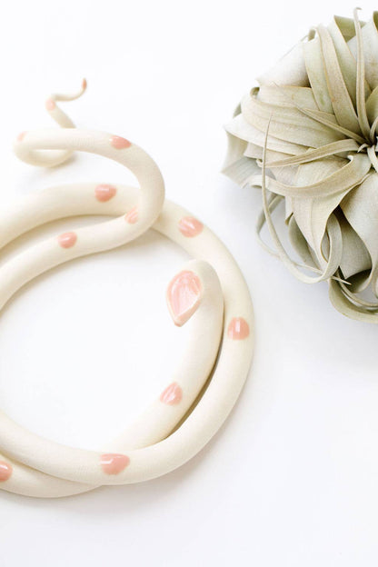 Large ceramic snake sculpture by Carter & Rose, detailed and textured with a smooth finish, set against a neutral background.
