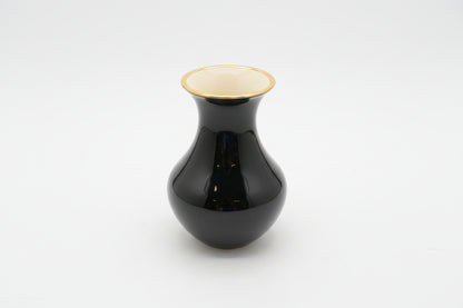 Vintage flower vase by The Vault Creative featuring a classic ceramic design with floral patterns and a narrow neck.