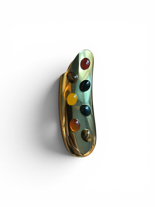 P. Grunsfeld curved stoner lighter by The Vault Creative, featuring a sleek design with a curved metal body and ignition mechanism.