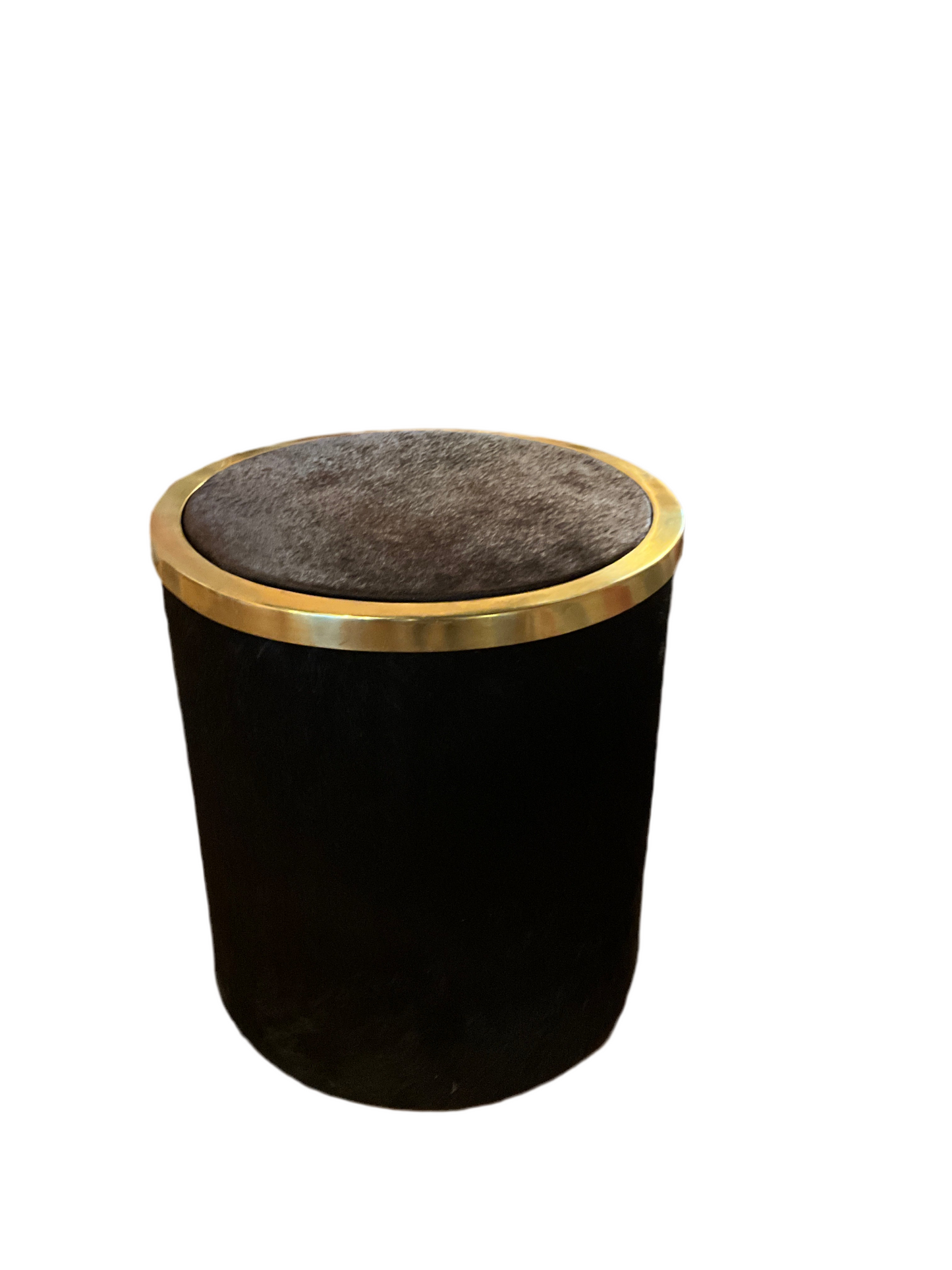 Luxury hair-on-hide table by ST x OH with a natural, textured leather surface and wooden legs, showcasing its stylish design.