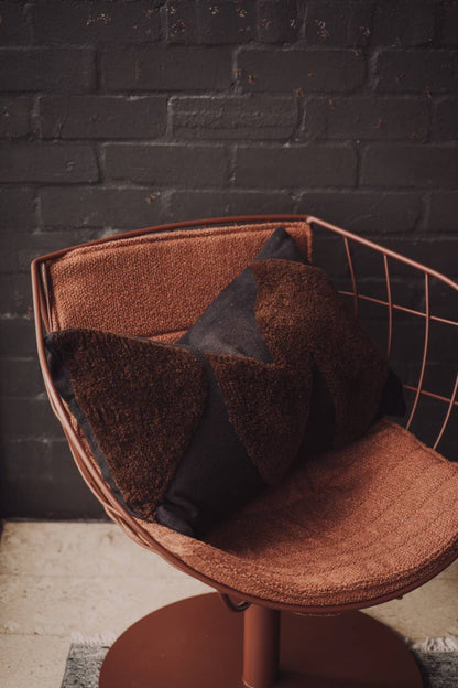 Abstract cushions in black and chocolate from Saardé featuring soft fabric and modern design for stylish home decor.