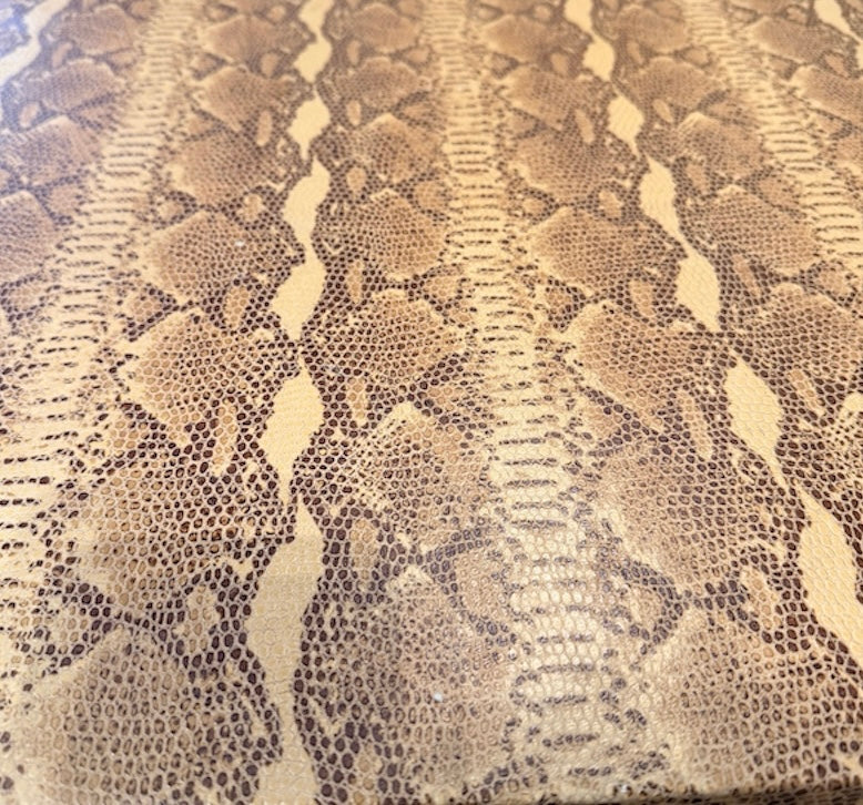 Vintage custom snakeskin coffee table by The Vault Creative featuring a sleek, textured snakeskin surface and modern design.