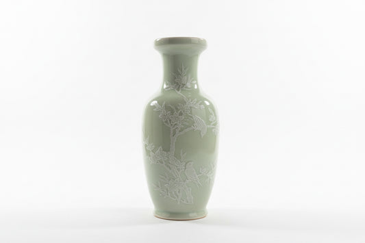Minty Asian vase by The Vault Creative with intricate patterns and a glossy finish, displayed on a wooden surface.