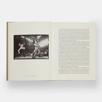Open Phaidon Annie Leibovitz At Work book showcasing a vibrant photography layout and signature portrait images.