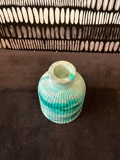 Emerald marble tabletop jar by Stone Textile Studio, featuring a glossy green and black marbled design for decorative storage.