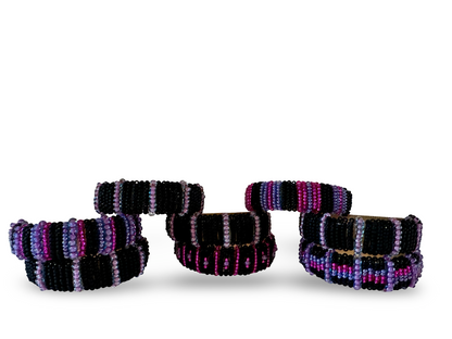 Set of 8 Phoebe hand-beaded napkin rings with intricate beadwork and elegant design for table decor.
