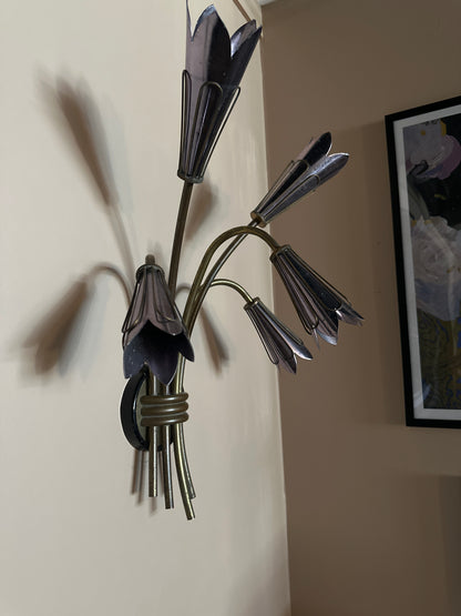Pair of vintage French flower sconces with ornate metalwork and floral designs, perfect for antique-style wall decor.