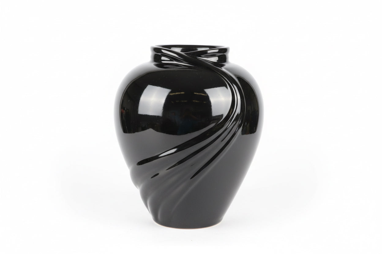 Metallic Swoop Vase by The Vault Creative with a sleek, curved design and shiny silver finish on a white background.