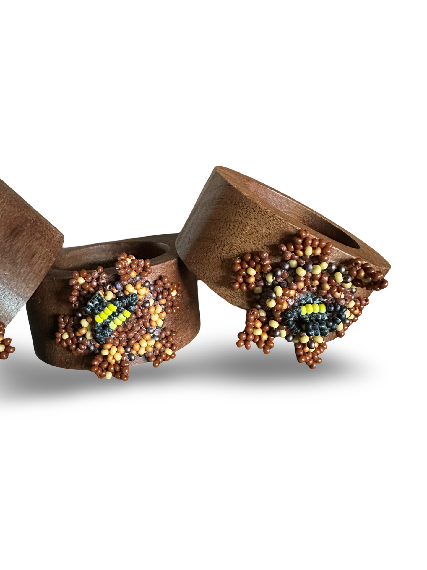 Handmade Phoebe bee napkin rings with detailed bee design, perfect for adding charm to table settings.