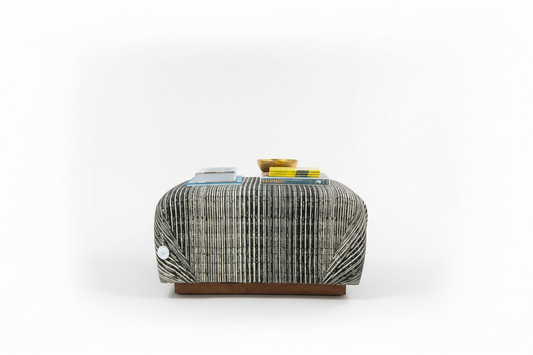 Vintage Ottoman Coffee Table by The Vault Creative with wooden top and carved base, ideal for living room decor.