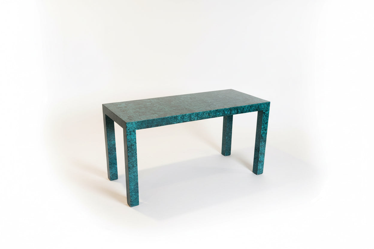 Faux Malachite console table by The Vault Creative featuring a rectangular top and decorative gold accents.