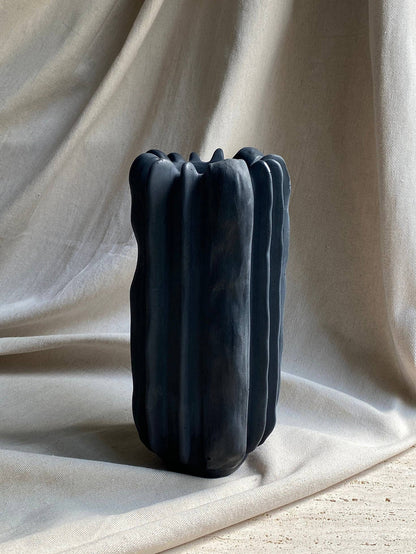 Concrete vase by Atelier La Rouleuse, modern cylindrical design with textured surface, perfect for contemporary home decor.
