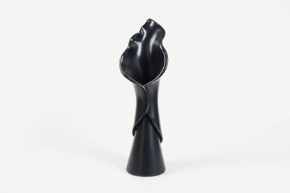 Tulip-shaped ceramic vase by The Vault Creative with a glossy finish, ideal for floral arrangements or decorative display.