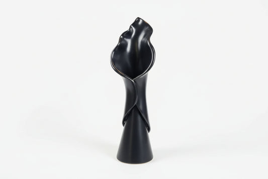 Tulip-shaped ceramic vase by The Vault Creative with a glossy finish, ideal for floral arrangements or decorative display.