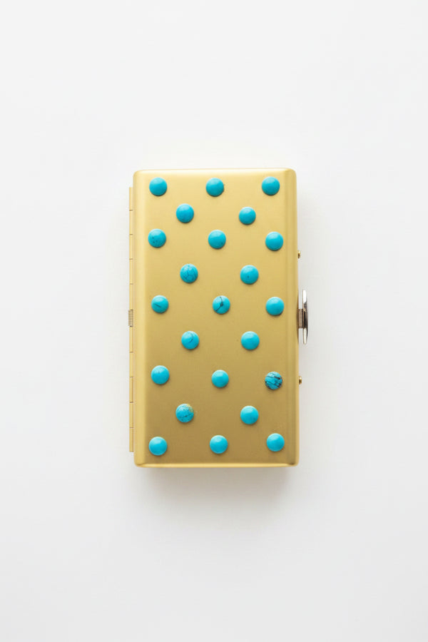 Vintage P. Grunsfeld cigarette case by The Vault Creative with intricate metal detailing and compact design.