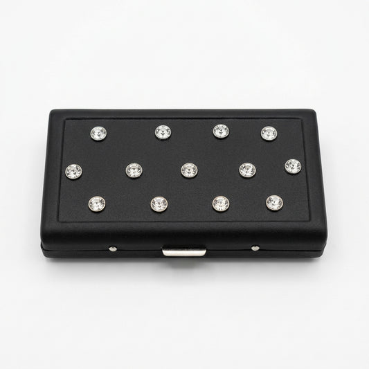 P.Grunsfeld black cigarette case by The Vault Creative with iridescent oil slick gem accents and sleek metallic finish.