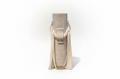 White ceramic vase by Karen Tinney for The Vault Creative, featuring a sleek, modern design with a smooth finish.