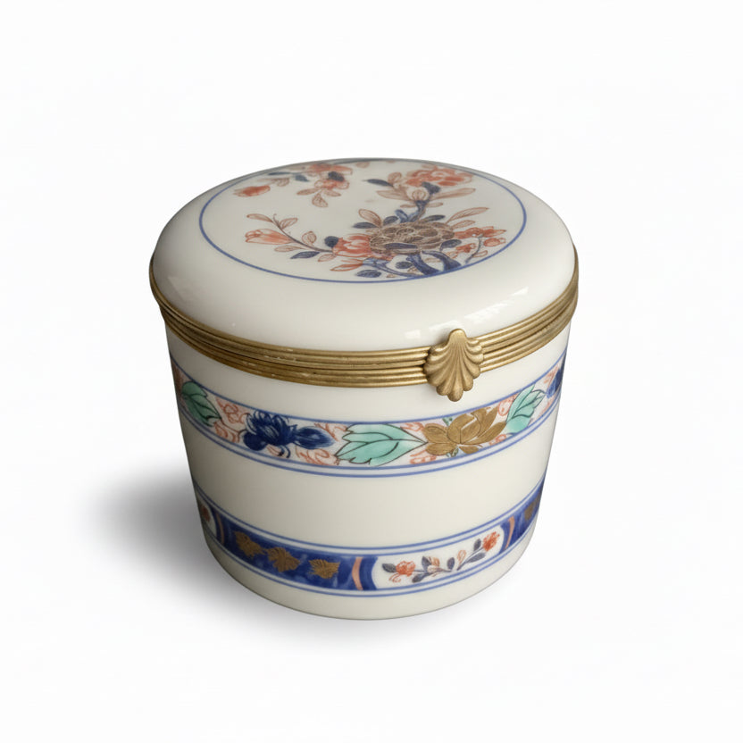Vintage Limoges porcelain box with intricate floral design and gold accents, crafted by The Vault Creative.