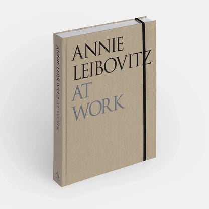 An image of the "Annie Leibovitz At Work" book by Phaidon, showing the cover with a portrait of Annie Leibovitz.