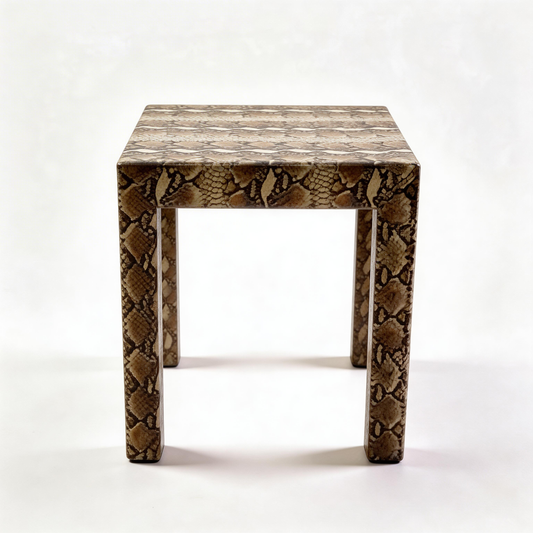 Vintage snakeskin side coffee table by The Vault Creative with a sleek, textured snakeskin pattern and modern design.