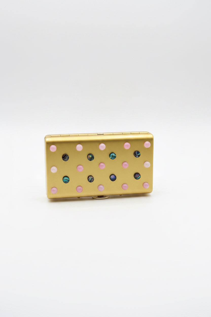 The Vault Creative P. Grunsfeld cigarette case in turquoise with metallic accents, showcasing a sleek, vintage-inspired design.