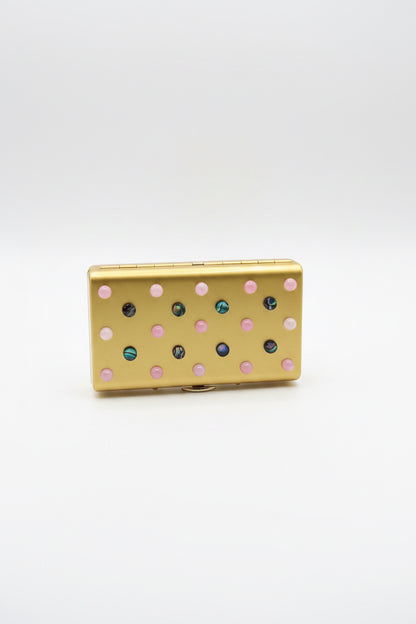 The Vault Creative P. Grunsfeld cigarette case in turquoise with metallic accents, showcasing a sleek, vintage-inspired design.