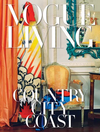 Open book titled "Vogue Living: Country, City" showing interior design images on the pages.