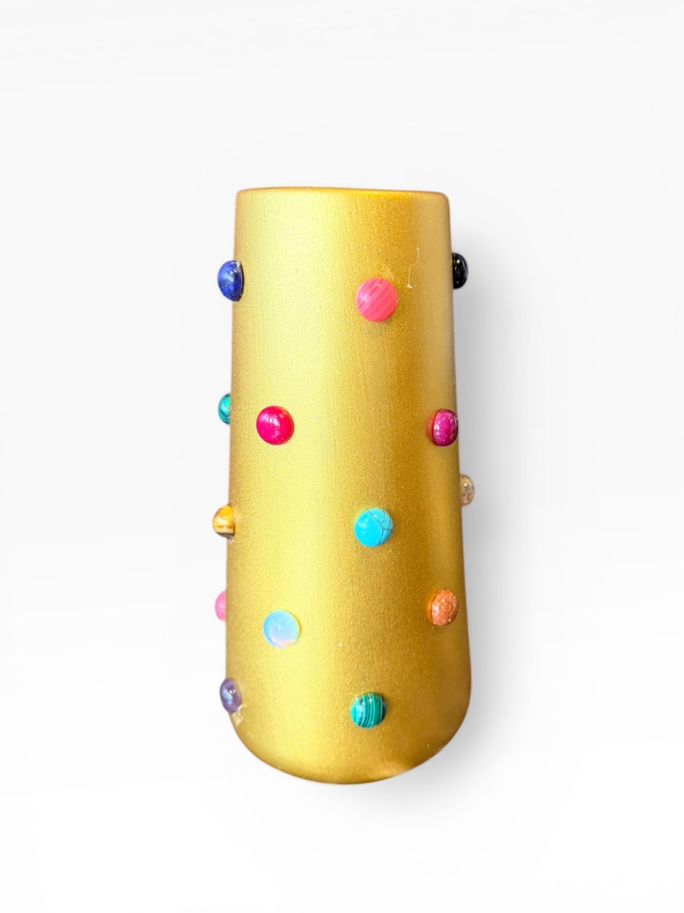 Gold vase by P.Grunsfeld from The Vault Creative, featuring a sleek, modern design with a shiny metallic finish.