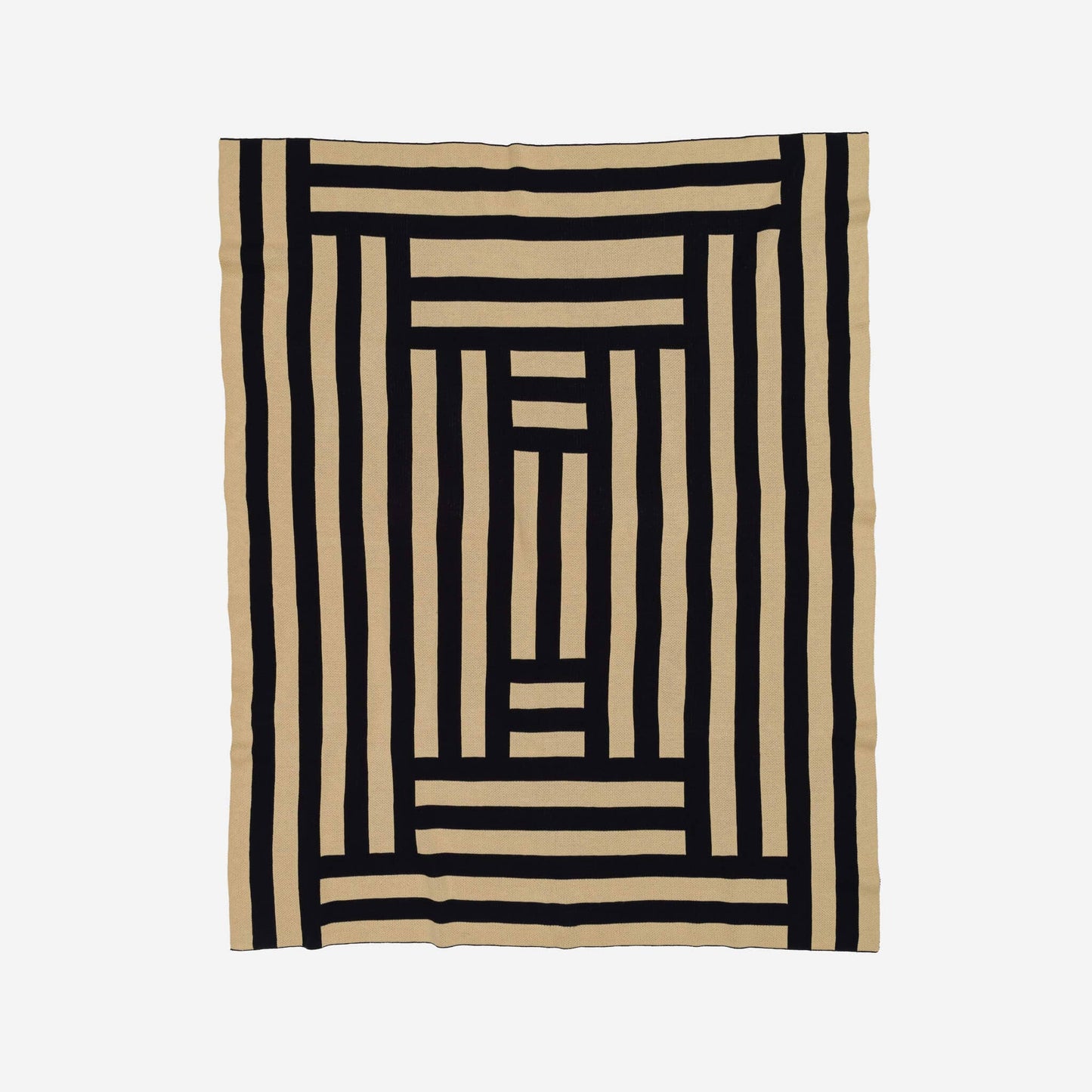 VERLOOP knits Columns Throw featuring a cozy, textured knit fabric in neutral tones, perfect for added warmth and style.