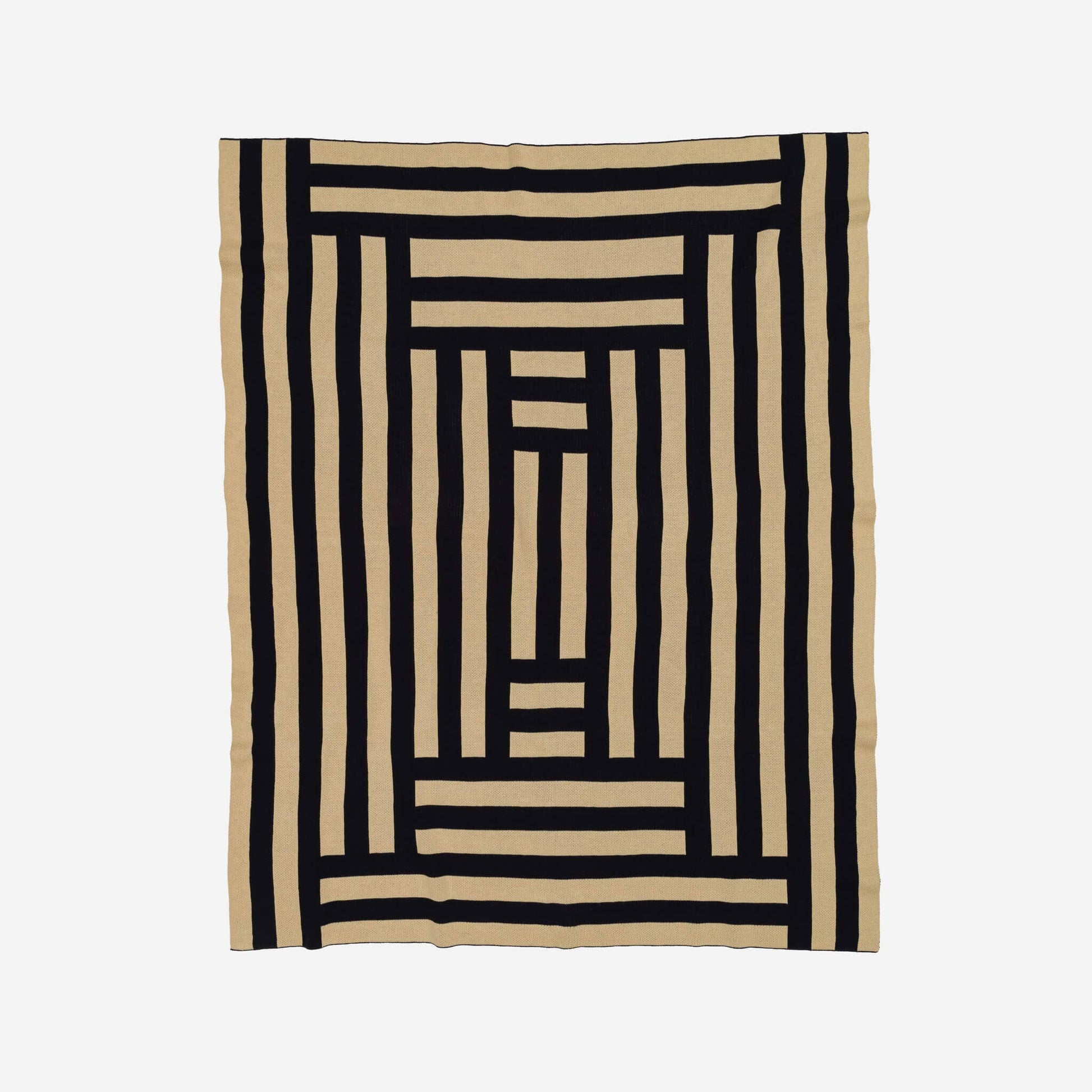 VERLOOP knits Columns Throw featuring a cozy, textured knit fabric in neutral tones, perfect for added warmth and style.