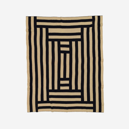 VERLOOP knits Columns Throw featuring a cozy, textured knit fabric in neutral tones, perfect for added warmth and style.