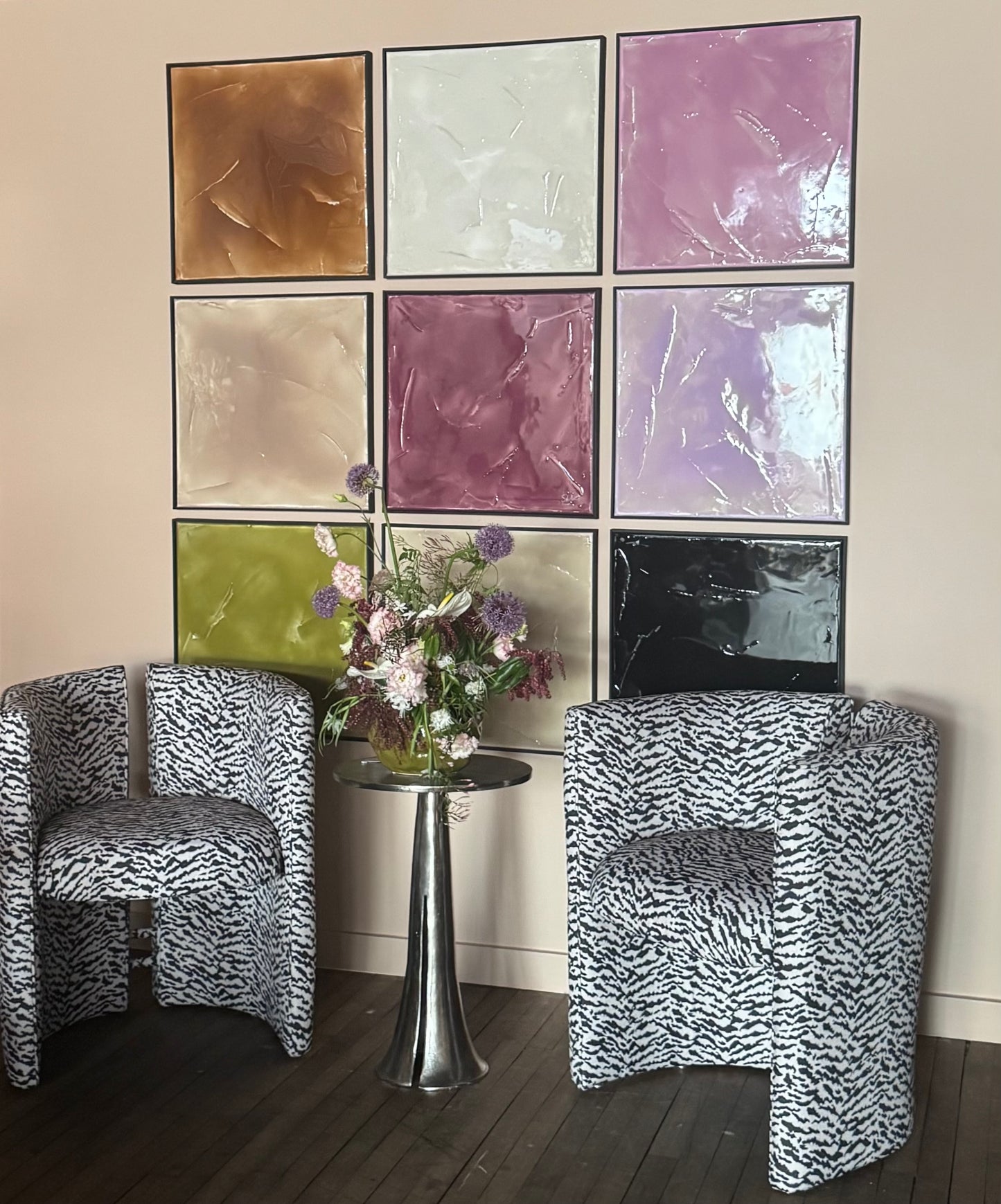 Black and white tiger print chair by The Vault Creative, showcasing a stylish and bold animal-themed upholstered seating piece.