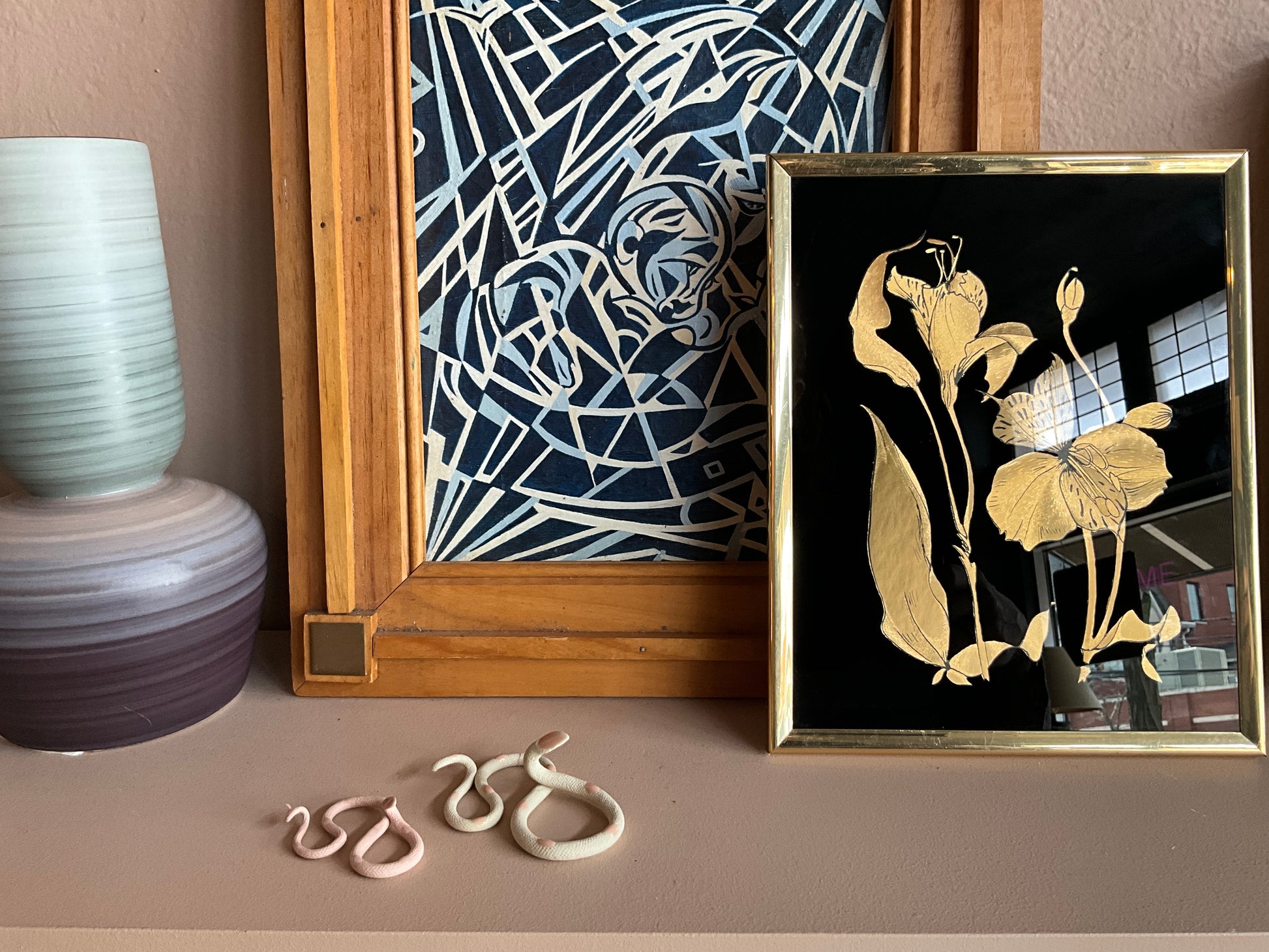 The Vault Creative Sofie snake sculpture with a sleek, modern design in metallic finish, displayed on a neutral background.
