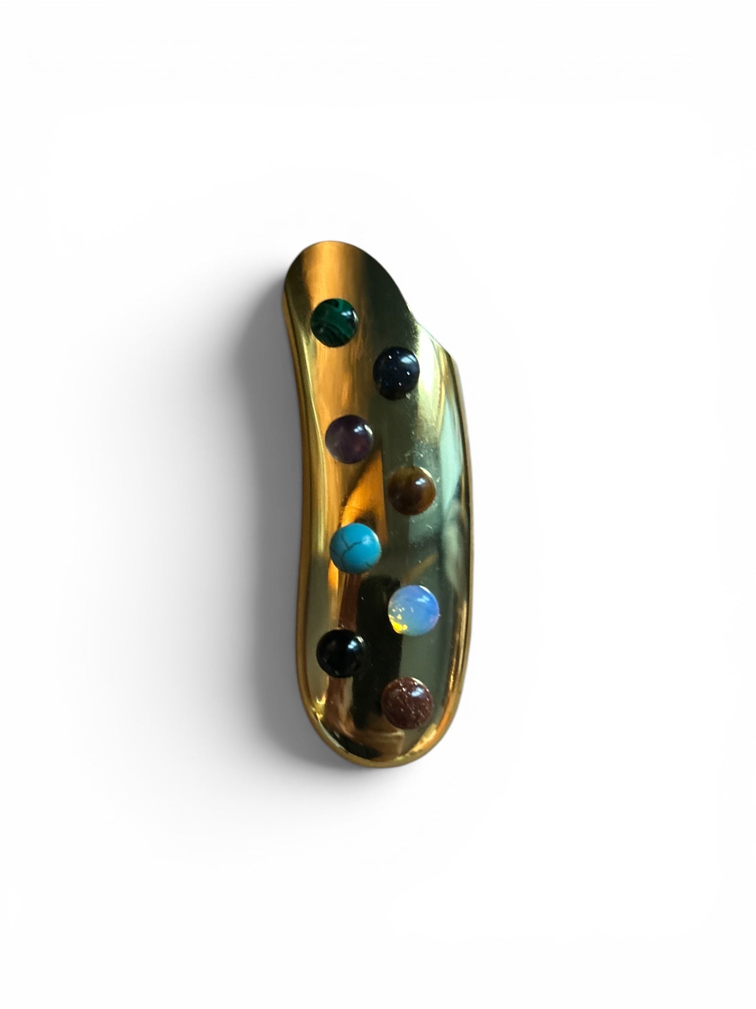 P. Grunsfeld Curved Stoner Lighter by The Vault Creative, black metal lighter with curved design and ignition button visible.