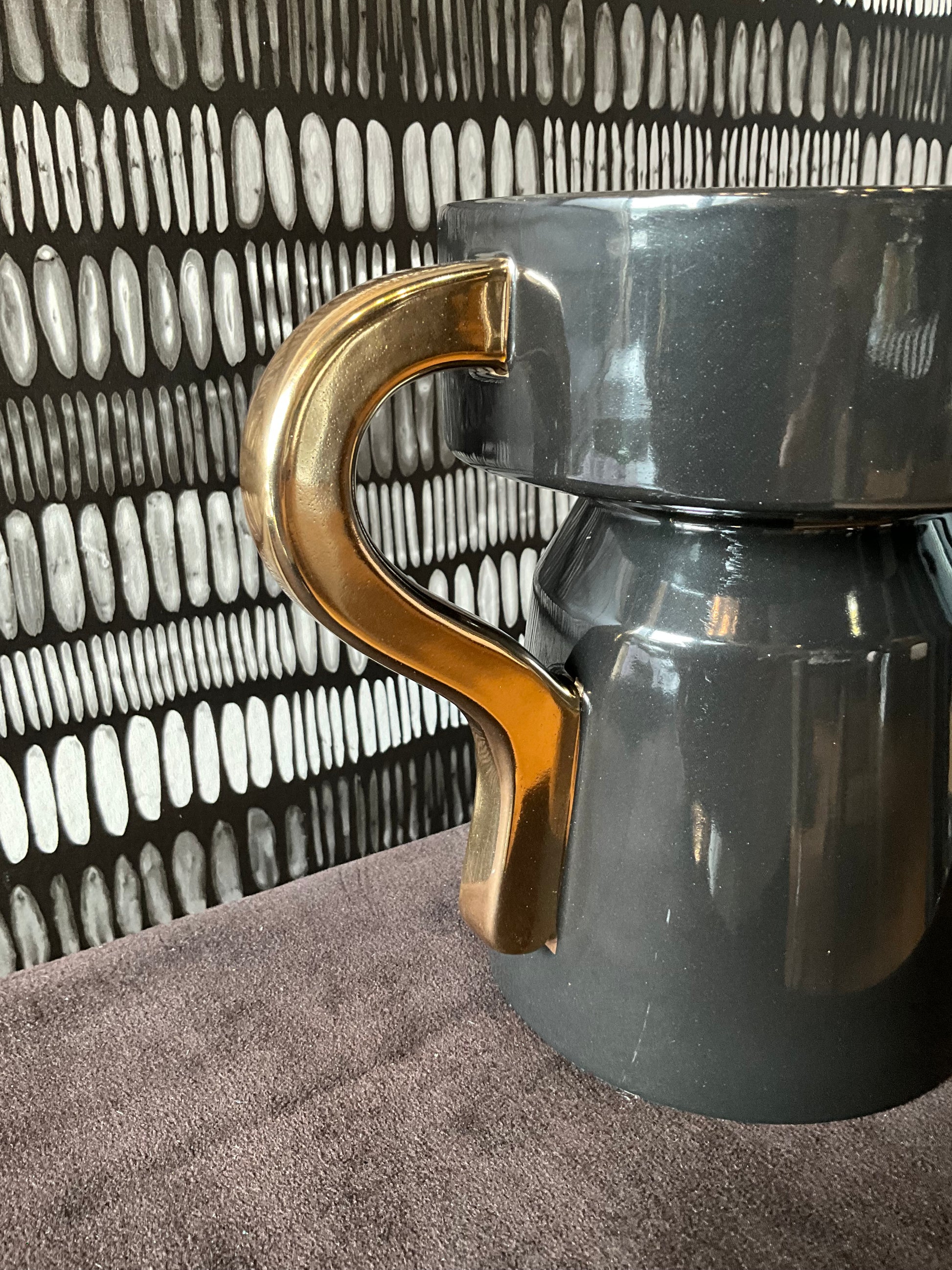French black and gold ceramic vase by The Vault Creative, featuring a glossy finish and elegant design.